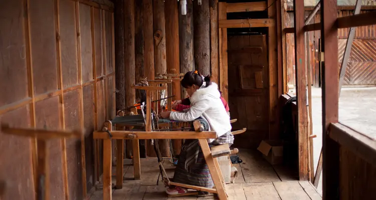 a woman doing weaving