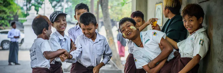 School kids playing in the street of Yangon