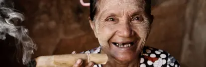 An old Chin woman smoking a big cigar in Bagan