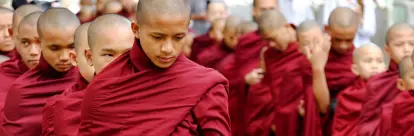 Monks waiting in line to get their lunch in Mahagandayon Monastery