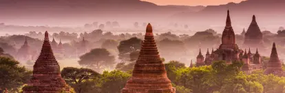 Bagan plains dotted with pagodas at dusk