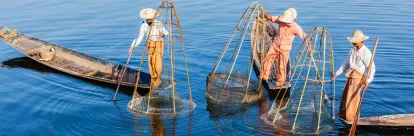 Fishermen in Inle Lake waiting for tell-tale of fish